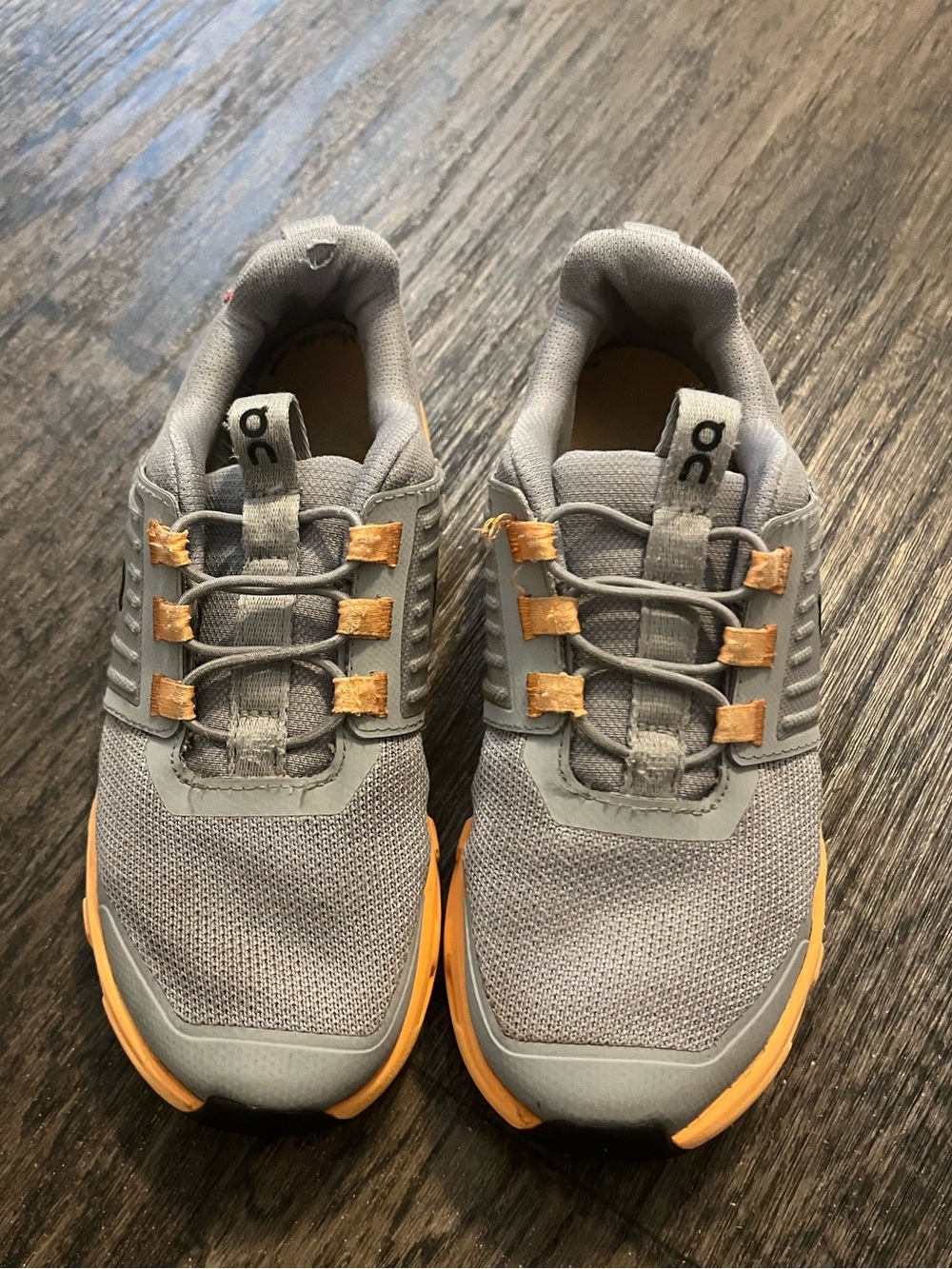 On Running Grey Sneakers with Orange Sole